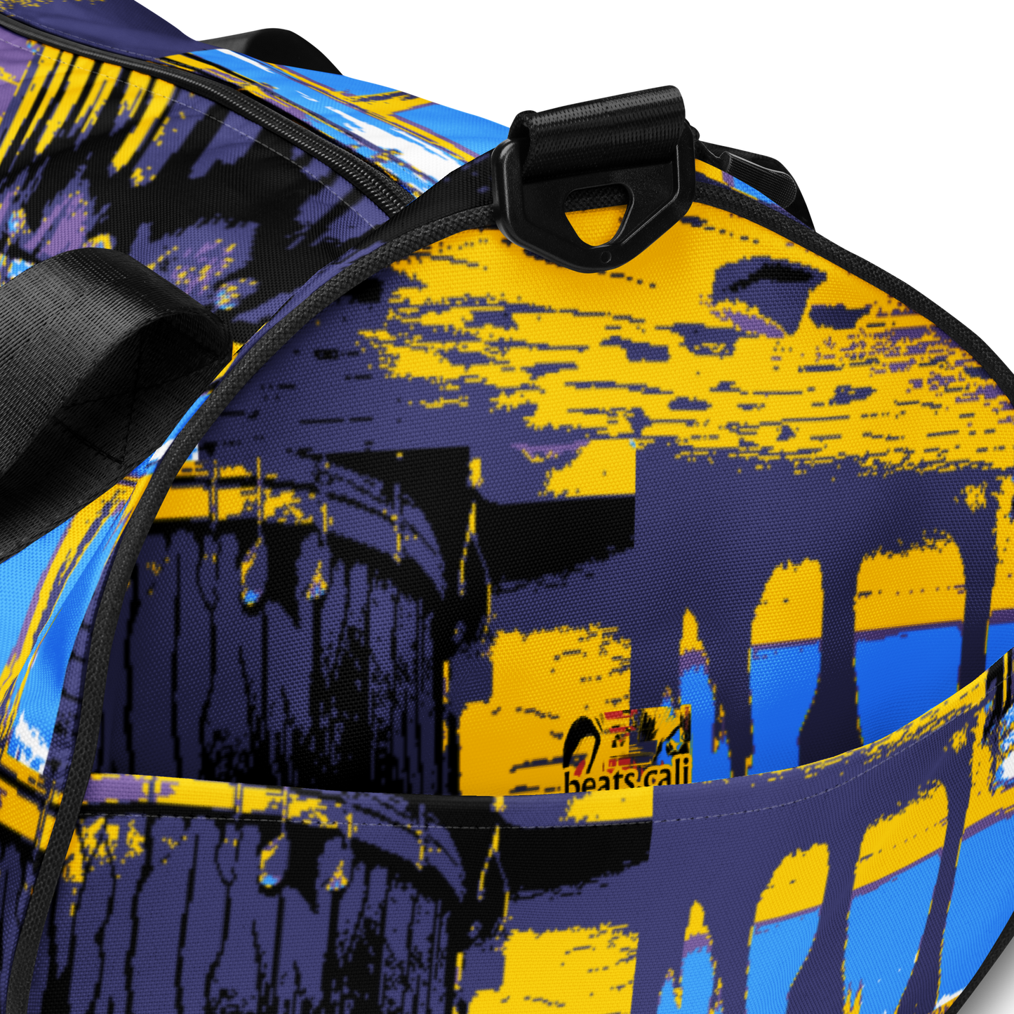 Experience the perfect blend of durability, style, and artistic flair with beats.cali Gym Bag. Crafted from premium, water-resistant materials, this bag is built to withstand the rigors of your daily workout routine. Its sleek design and vibrant art-themed patterns make a bold statement wherever you go. Featuring multiple compartments and pockets, it offers ample storage space for all your gym essentials, keeping you organized and ready to conquer your fitness goals.